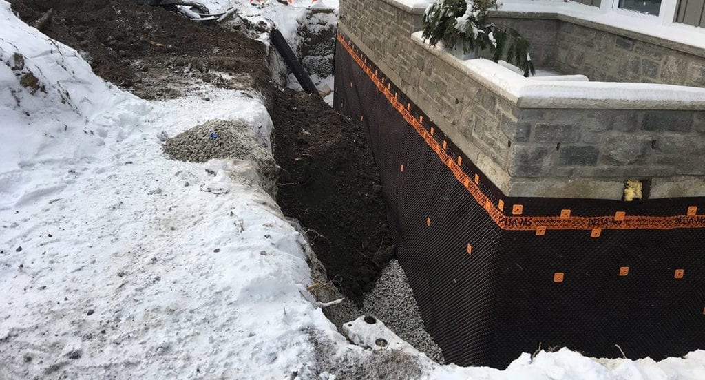 A hole is dug to do foundation repair.