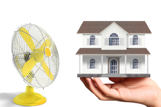 An image of a fan next to a house being held by a hand.