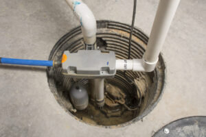 A sump pump is set up in the basement of a home.