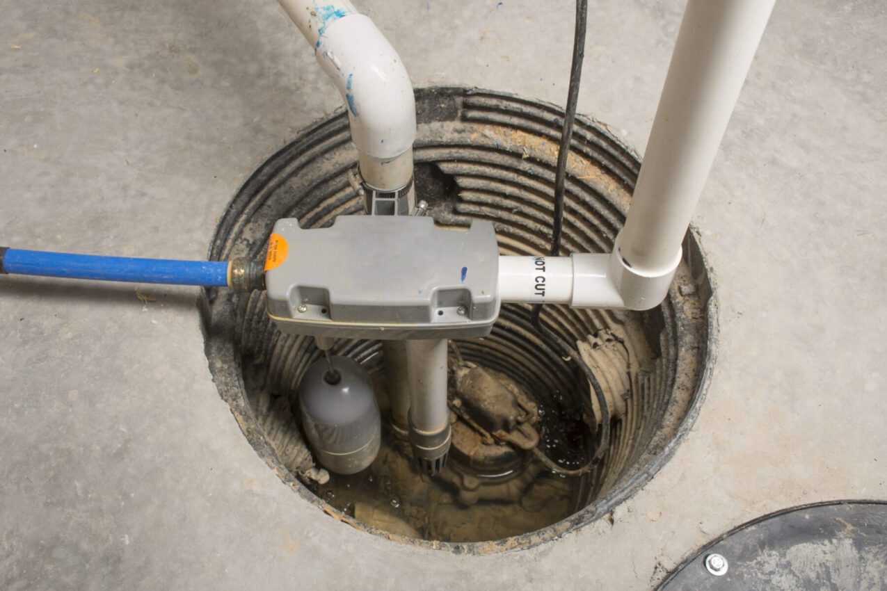 A sump pump is set up in the basement